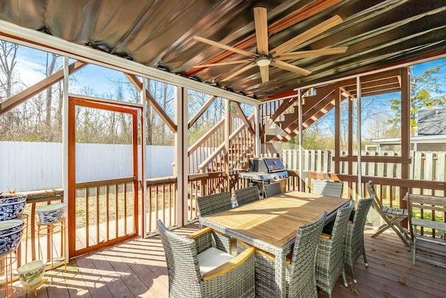 sunroom / solarium featuring a wealth of natural light and ceiling fan