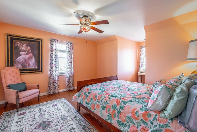 bedroom with light hardwood / wood-style floors and ceiling fan