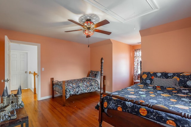 bedroom with hardwood / wood-style flooring and ceiling fan