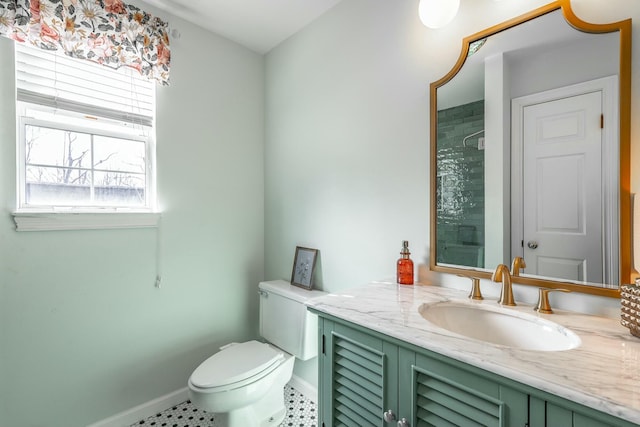 bathroom with walk in shower, vanity, and toilet