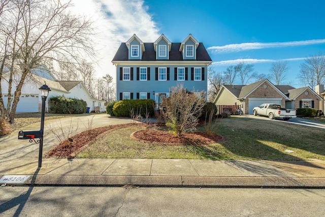 view of front of home featuring a garage and a front lawn