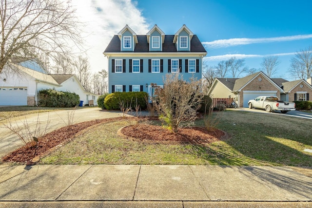 view of front of home with a garage and a front lawn