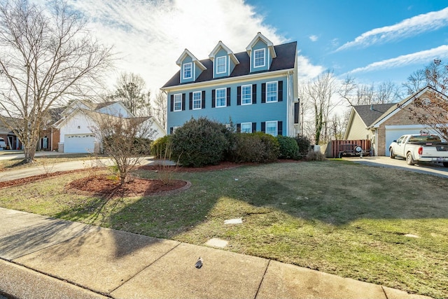 view of front of property with a garage and a front yard