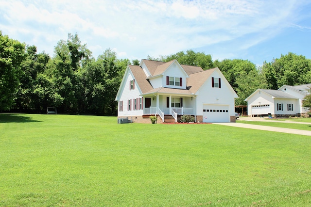 view of front facade with a garage, a front yard, and covered porch