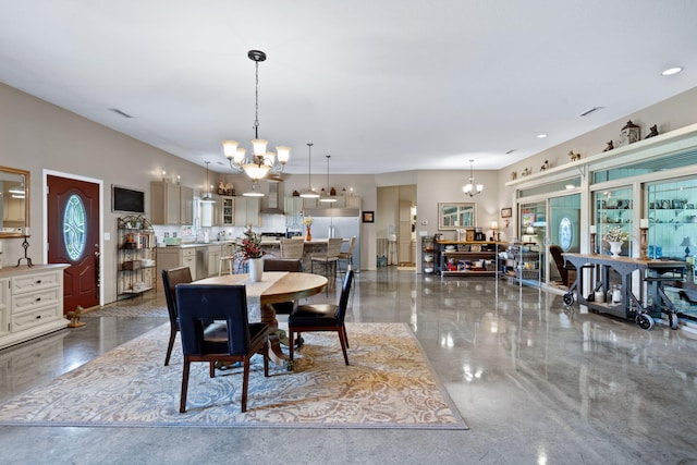 dining area featuring an inviting chandelier