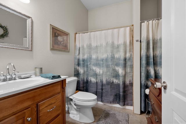 bathroom with vanity, tile patterned floors, toilet, and walk in shower