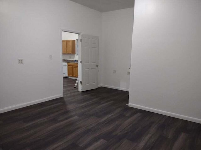 empty room featuring dark wood-type flooring