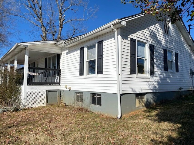 view of home's exterior with a lawn