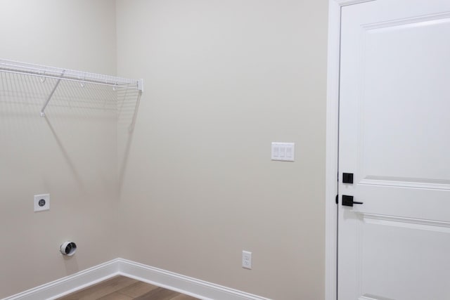 washroom featuring electric dryer hookup and hardwood / wood-style floors