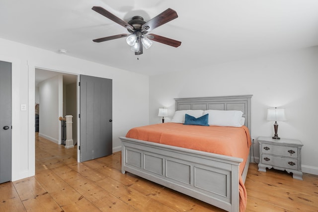 bedroom featuring ceiling fan and light wood-type flooring