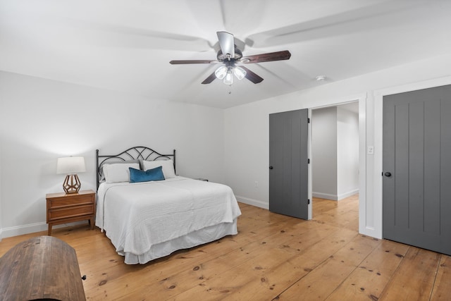 bedroom with ceiling fan and light wood-type flooring