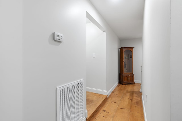 corridor featuring light hardwood / wood-style flooring