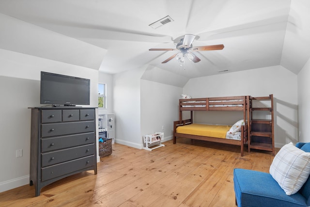 bedroom featuring vaulted ceiling, ceiling fan, and light wood-type flooring