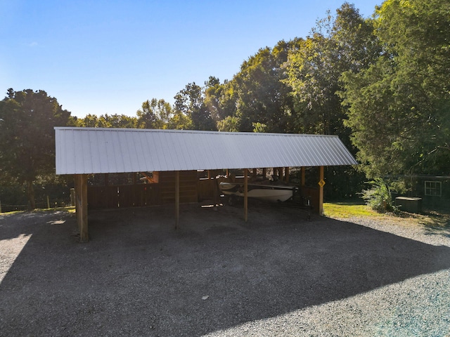 view of vehicle parking with a carport