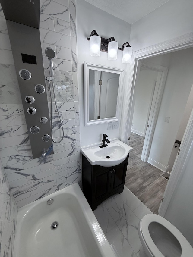 bathroom with vanity and tiled shower / bath