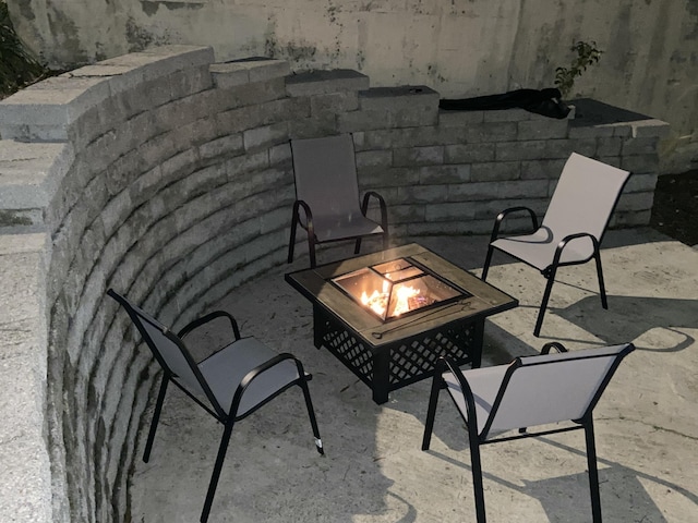 view of patio featuring an outdoor fire pit