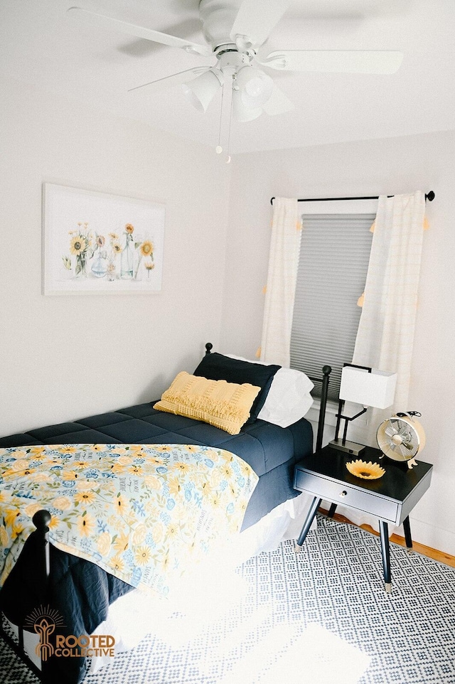 bedroom featuring a ceiling fan and wood finished floors