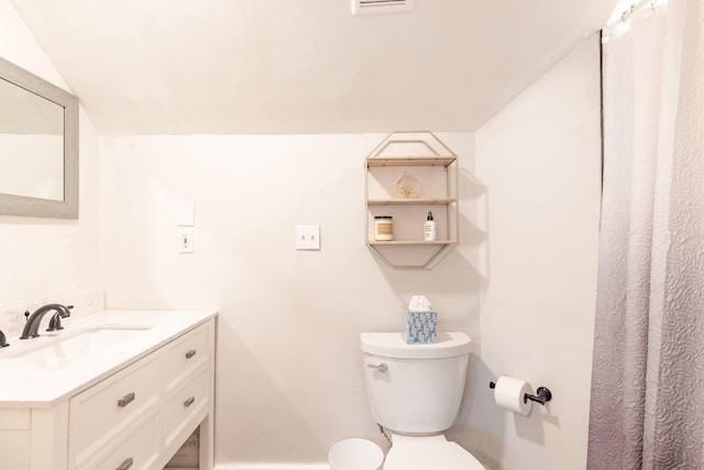 full bathroom with toilet and vanity