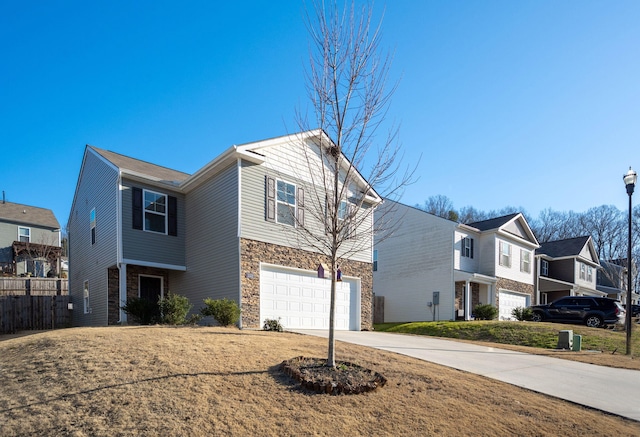 view of front of property with a garage and a front lawn