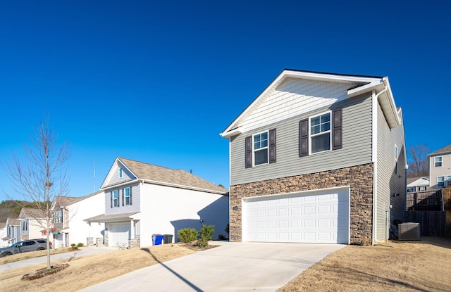 view of property featuring central AC and a garage