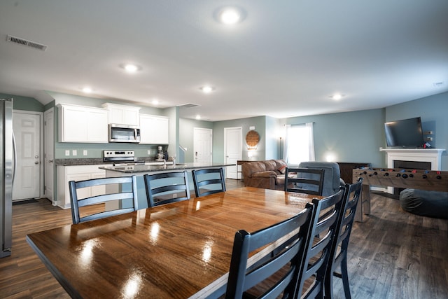 dining area with dark wood-type flooring