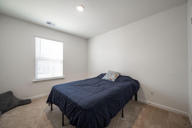 bedroom featuring carpet