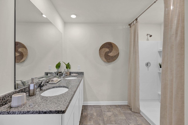 bathroom featuring vanity and curtained shower