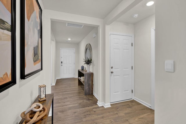 corridor featuring dark hardwood / wood-style floors