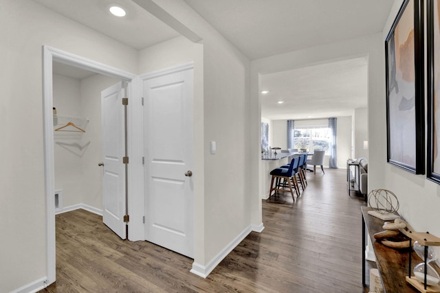 hallway featuring hardwood / wood-style flooring