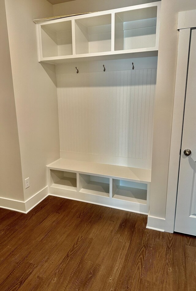 mudroom featuring baseboards and wood finished floors