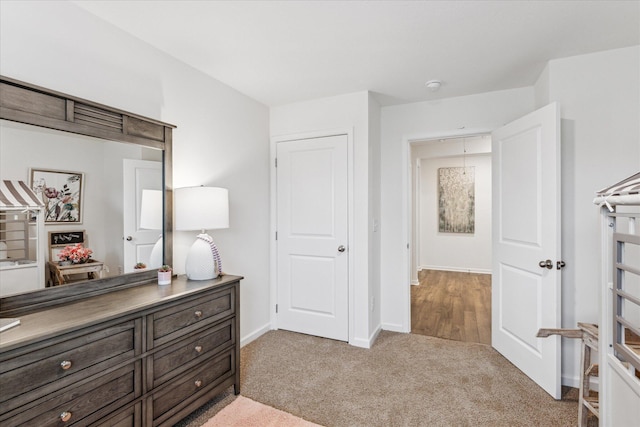 bedroom featuring light colored carpet