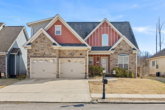 craftsman-style home with central AC unit and a garage