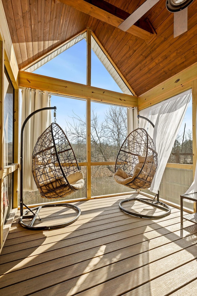 unfurnished sunroom featuring lofted ceiling and wooden ceiling