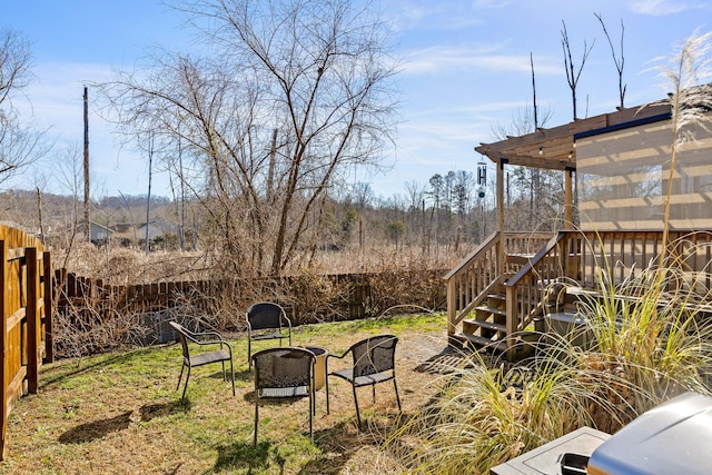 view of yard featuring a wooden deck