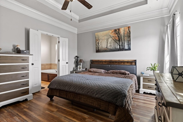 bedroom featuring crown molding, dark hardwood / wood-style floors, multiple windows, and a raised ceiling