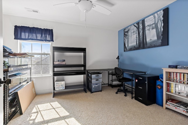 carpeted office with ceiling fan