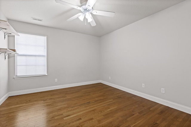 empty room with hardwood / wood-style floors and ceiling fan