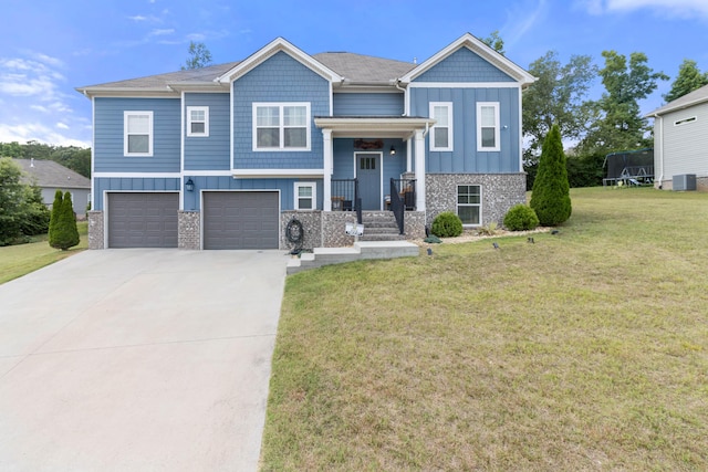 view of front of property with a garage and a front lawn