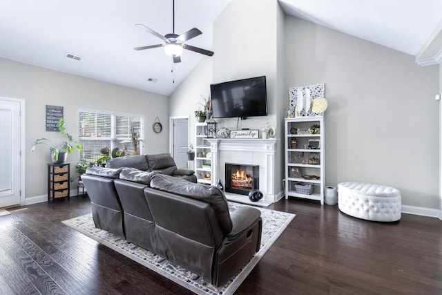 living room featuring ceiling fan, dark wood-type flooring, and high vaulted ceiling