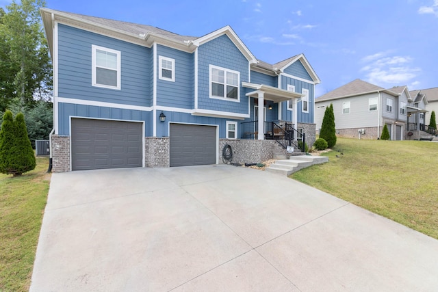 view of front of property featuring central AC, a garage, and a front lawn