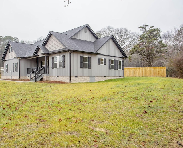 view of side of property with a yard