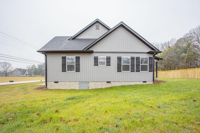 view of home's exterior with a yard