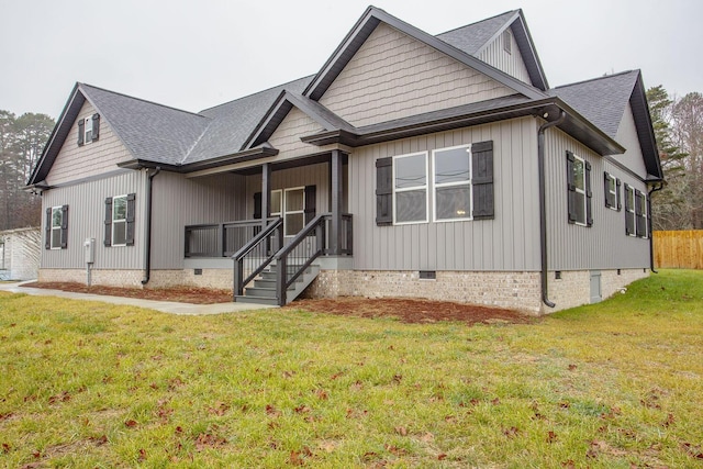 view of front of house featuring a front yard and covered porch