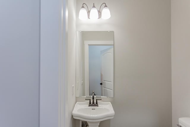 bathroom with sink and toilet