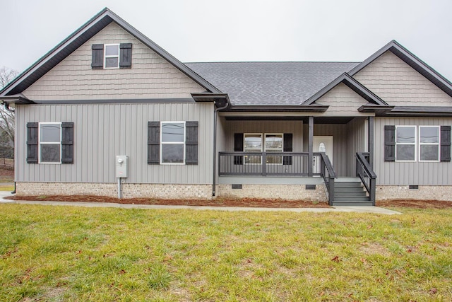 view of front of house featuring a front yard and covered porch