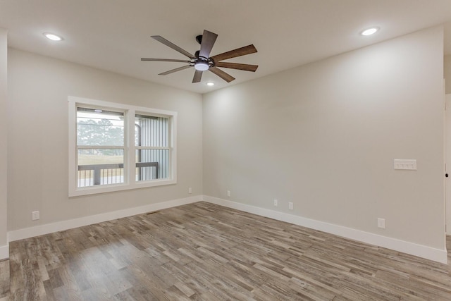 unfurnished room featuring ceiling fan and light hardwood / wood-style floors