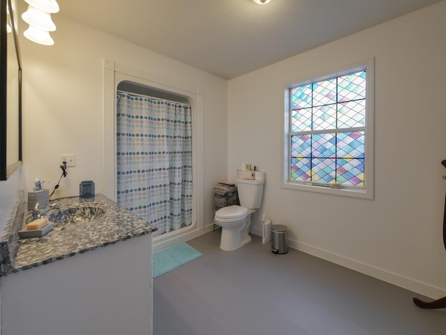 bathroom with vanity, toilet, and a shower with curtain