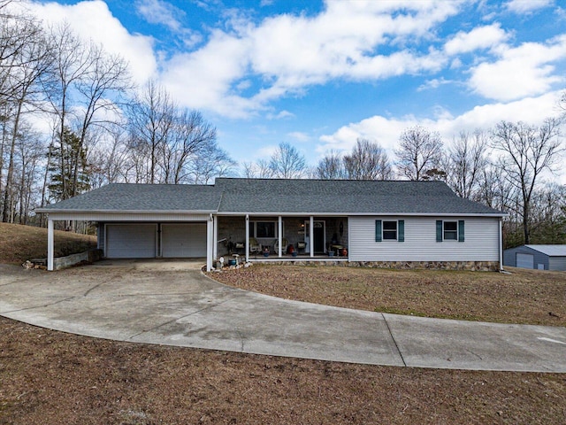 single story home with a garage and covered porch