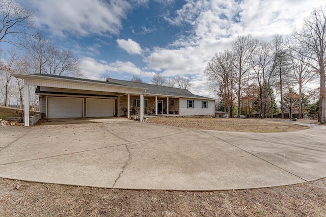 view of front of property featuring a garage and covered porch