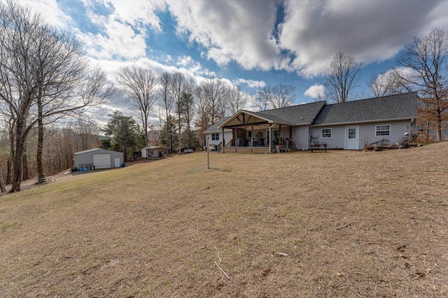 view of yard featuring an outbuilding and a garage